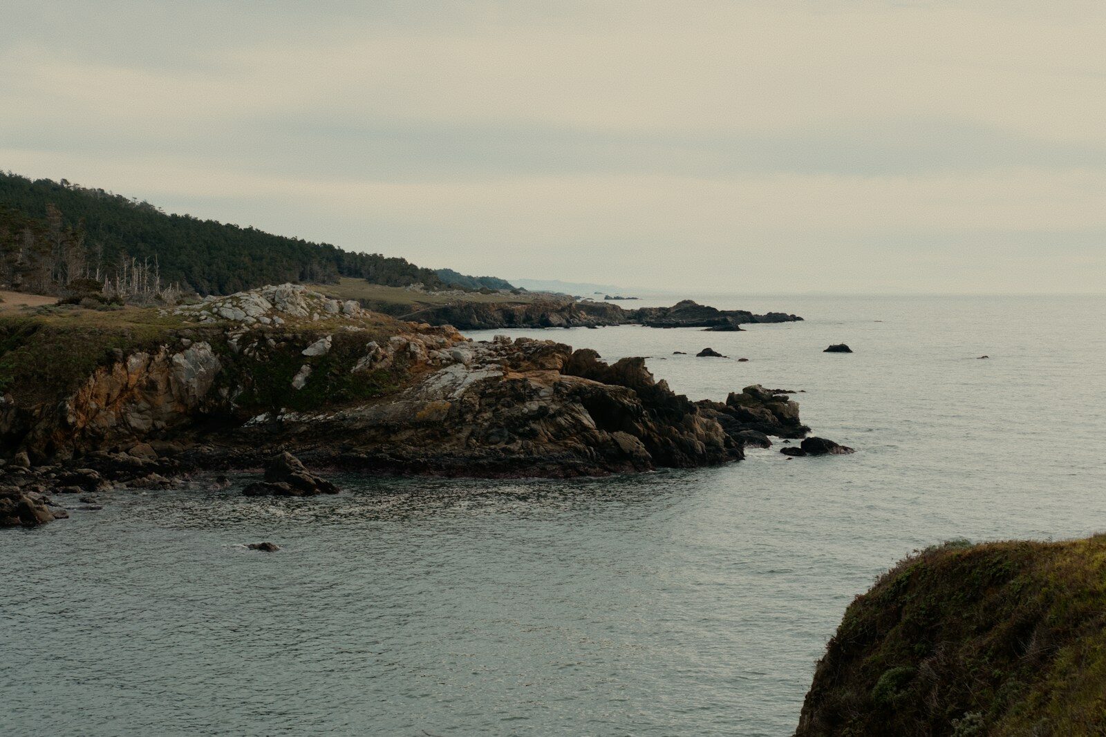 Rocky shoreline under an overcast sky